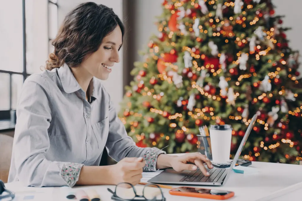 small business owner looks up tech tips on a laptop