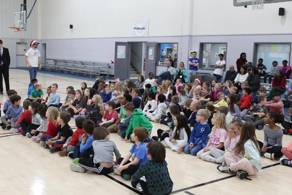 Boys & Girls Club members are surprised with laptops. 