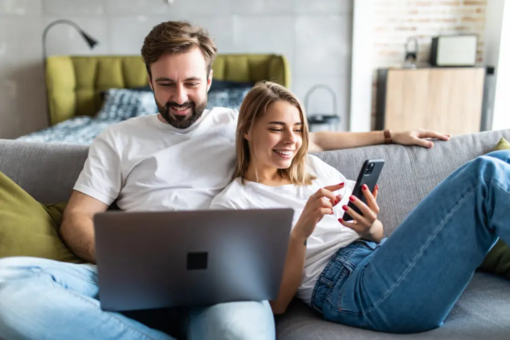 A couple enjoying Xfinity mobile hotspots and superfast internet.