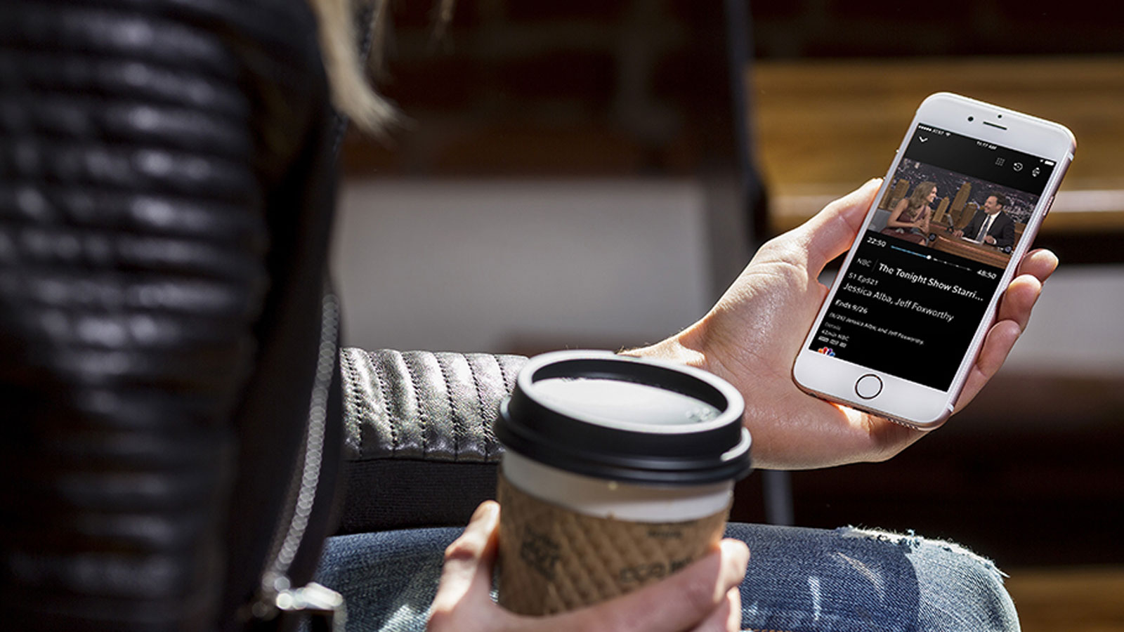 Woman viewing video content on iPhone