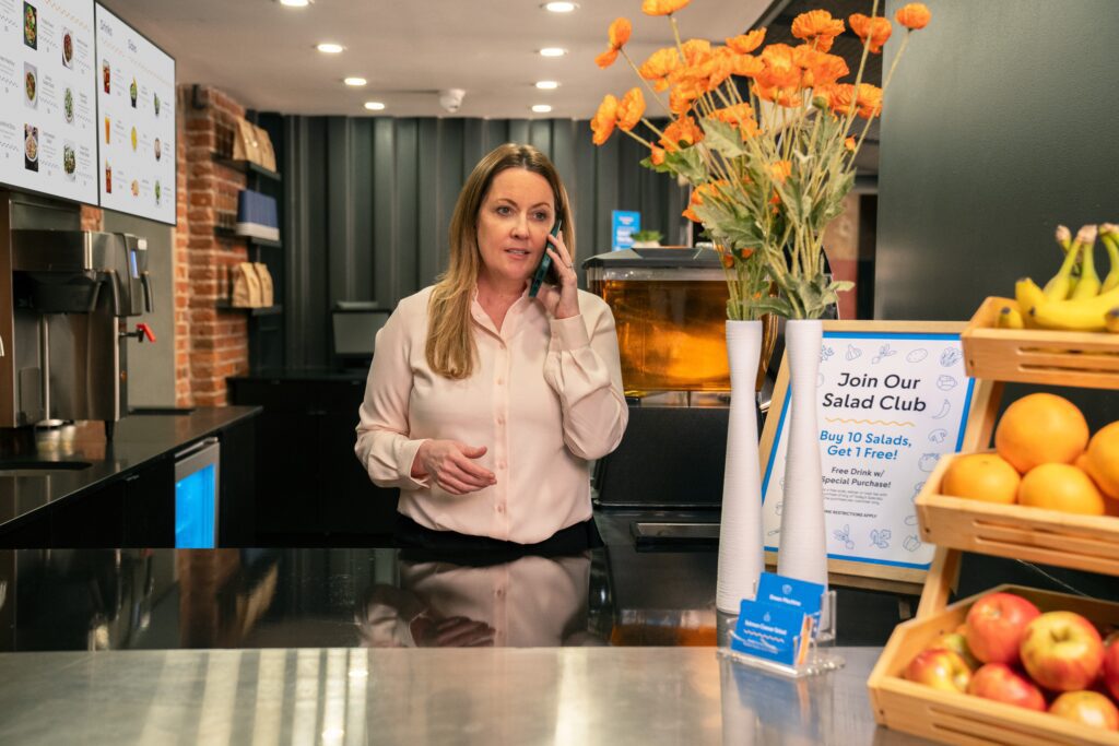 Cafe owner makes call using Comcast Business Mobile