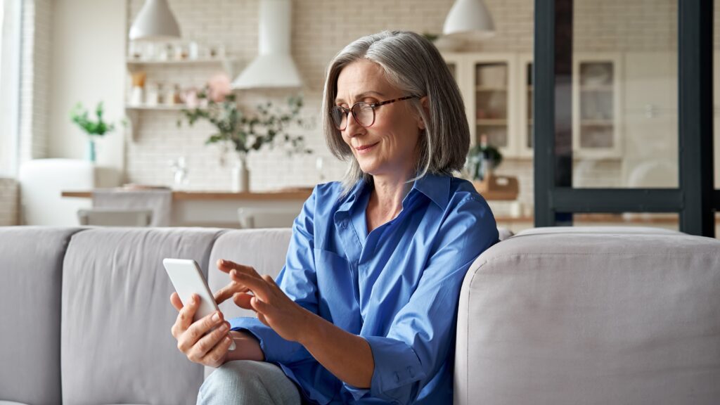 Woman spring cleaning apps on phone